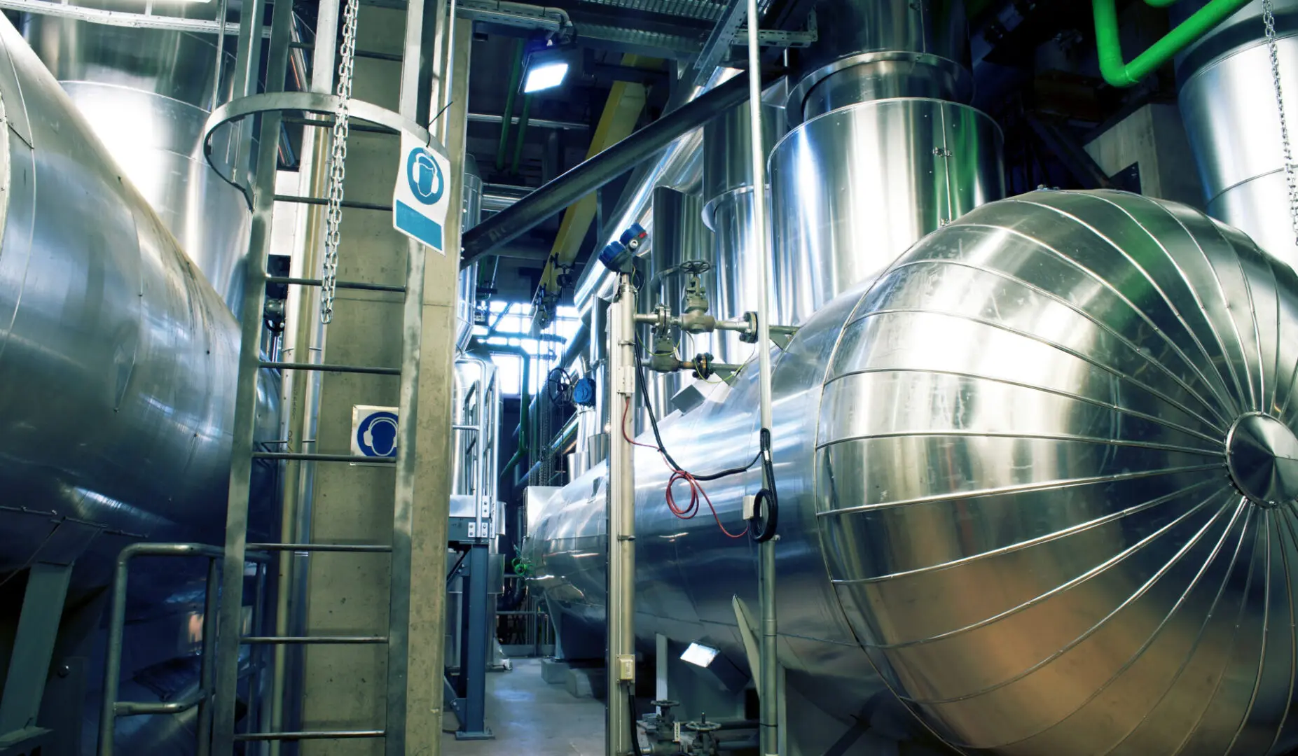 Equipment, cables and piping as found inside of a modern industrial power plant